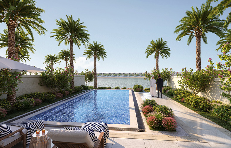 exterior shot of the pool with a view of the sea and palm trees